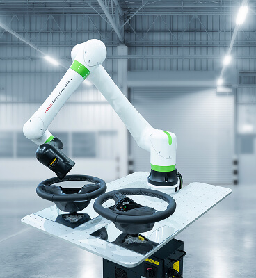 FANUC CRX-10iA/L inspecting steering wheels
