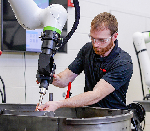 FANUC Employee Hand Guiding CRX Welding Cobot