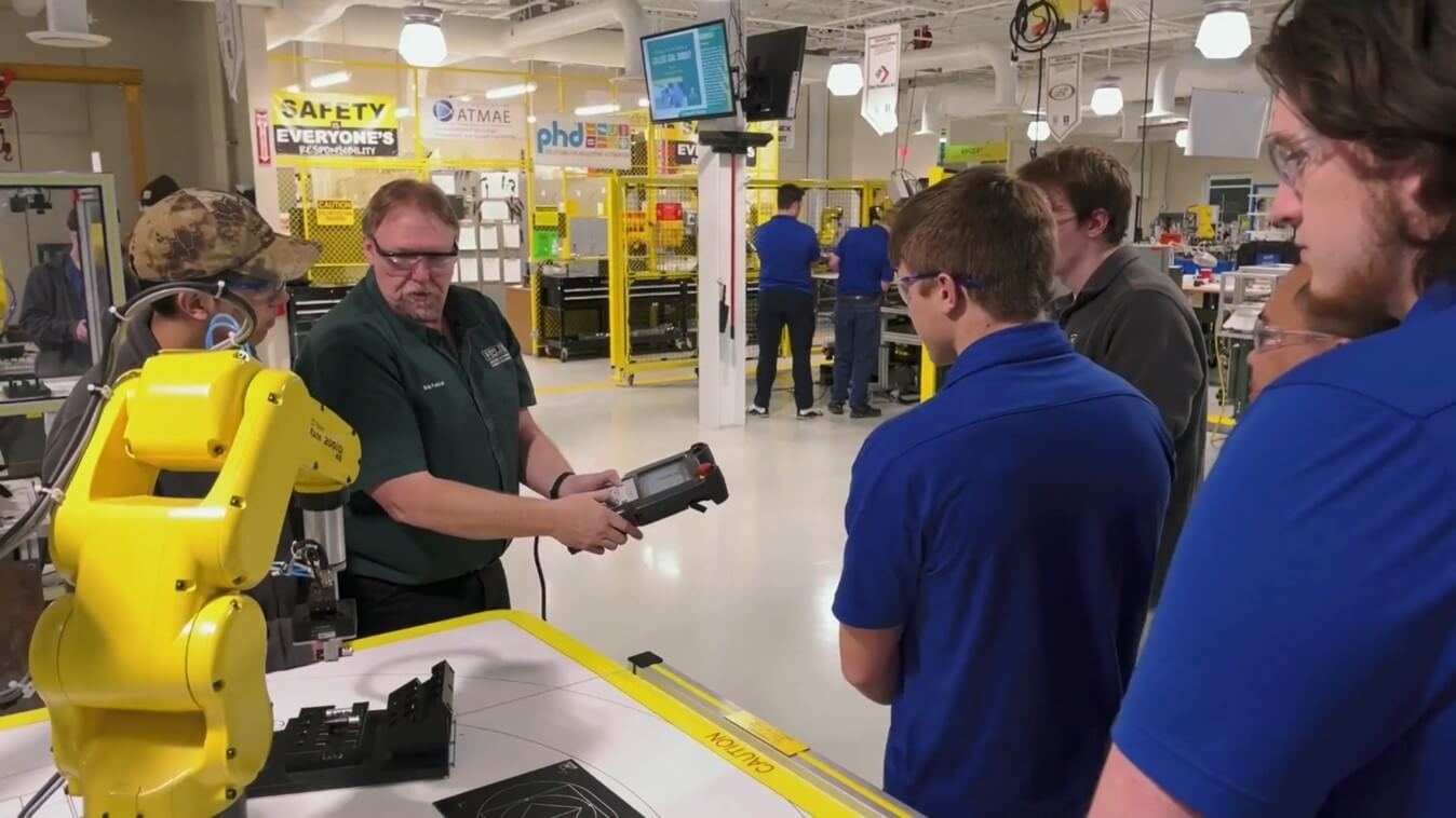 Lou Toth Assistant Professor at Ivy Tech instructs students on FANUC robot
