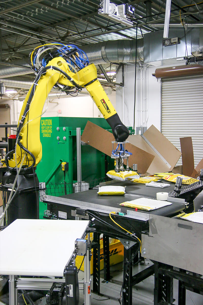 warehouse robot performs robotic induction process