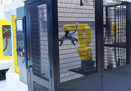 FANUC Robot in cage tending to ROBODRILL machine utilizing QSSR
