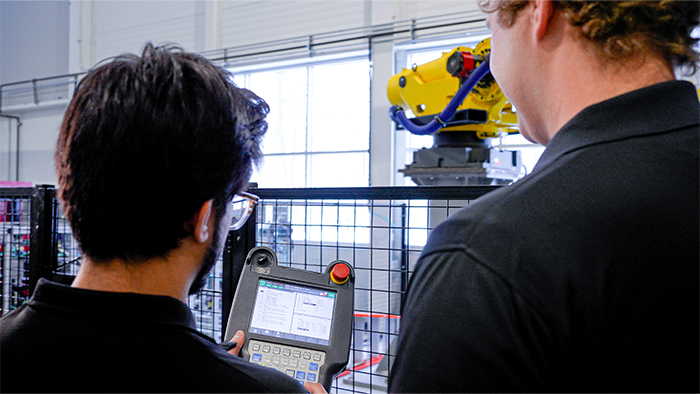 Engineers Programming Robot