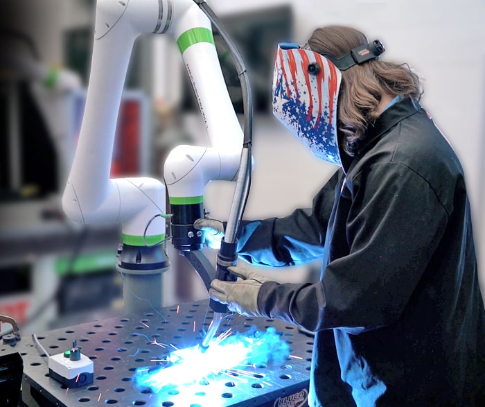 Welder working with CRX-10iA/L