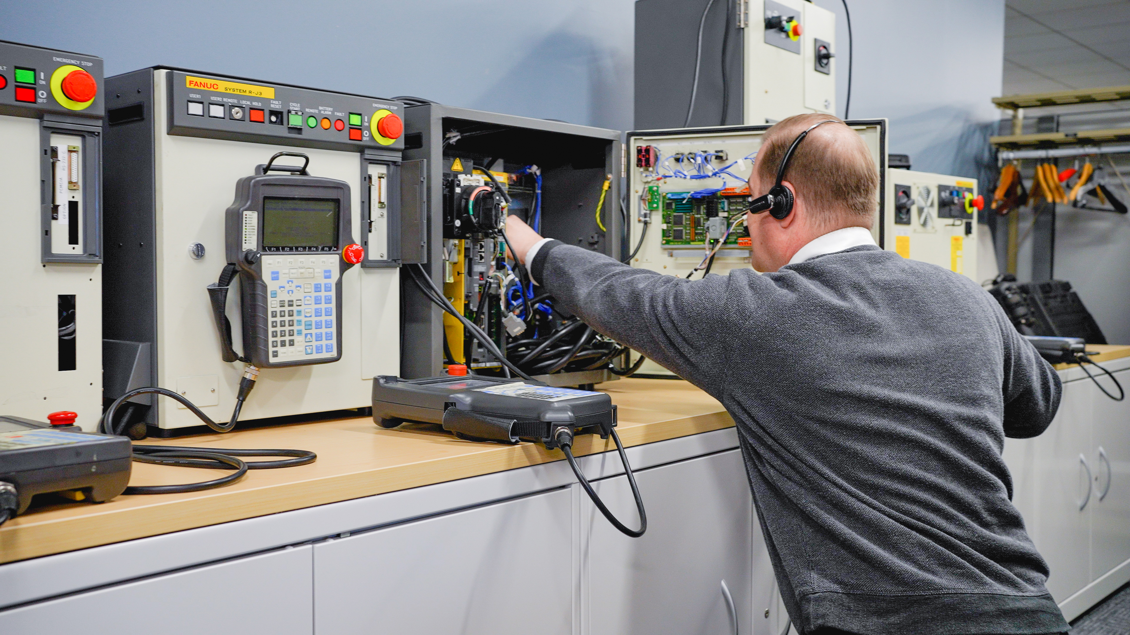 FANUC Technician Working on Robot Controller Field Service