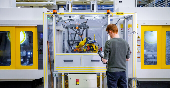 Student interacting with m 10 and robodrills card