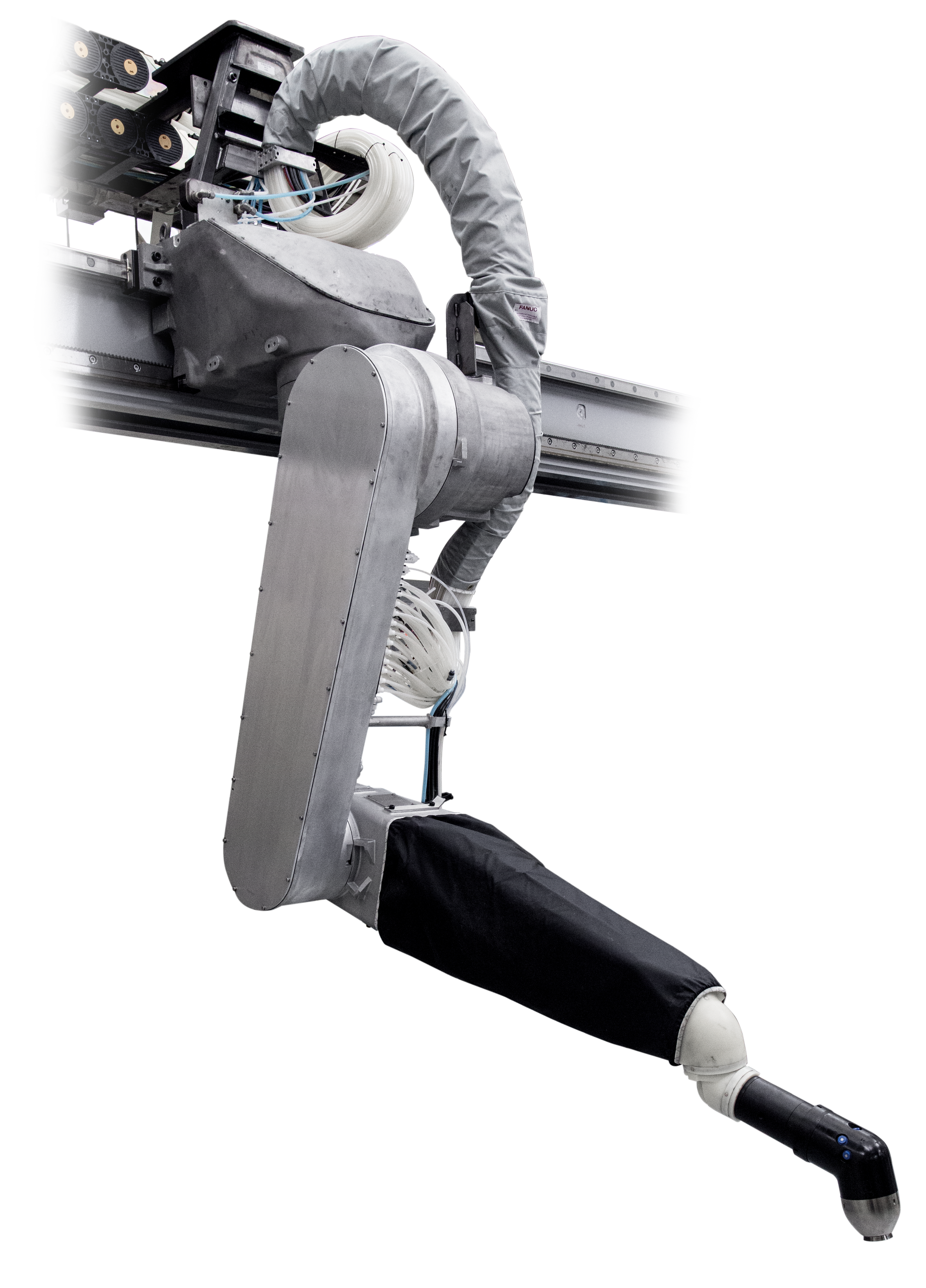 Industrial P-700iB robotic arm mounted on an overhead linear rail track, with articulated joints wrapped in protective gray and black bellows covers, ending in a sensor-equipped tool head.